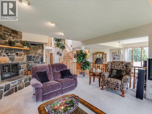 5725 Taghum Frontage Road, Taghum, BC - Indoor Photo Showing Living Room With Fireplace