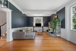 Living room with stone fireplace - 