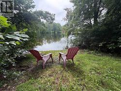 Relax in the sun and dip your toes in the River! - 