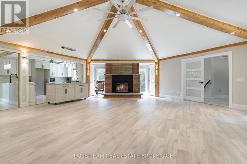 8 Joliet Crescent, Tiny, ON - Indoor Photo Showing Living Room With Fireplace