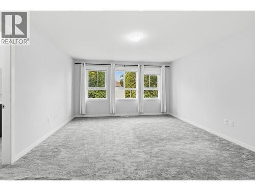 Primary bedroom- second floor - 680 Old Meadows Road Unit# 74, Kelowna, BC - Indoor Photo Showing Other Room