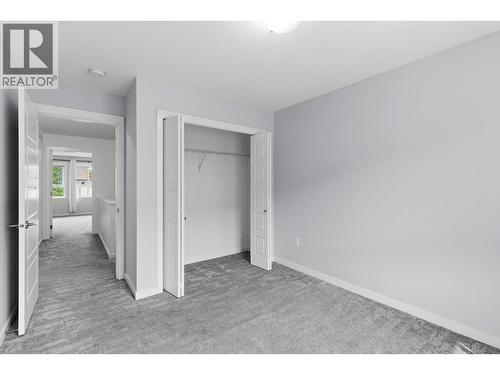 2nd bedroom- upper level - 680 Old Meadows Road Unit# 74, Kelowna, BC - Indoor Photo Showing Other Room