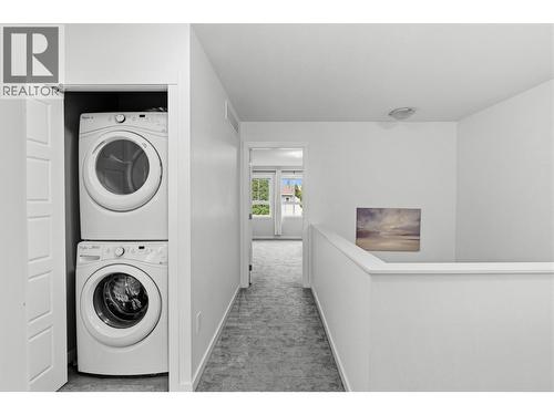 2nd floor landing with laundry closet - 680 Old Meadows Road Unit# 74, Kelowna, BC - Indoor Photo Showing Laundry Room