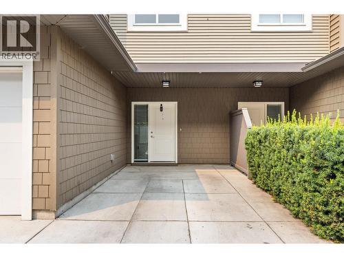 Front of unit with driveway parking - 680 Old Meadows Road Unit# 74, Kelowna, BC - Outdoor With Exterior