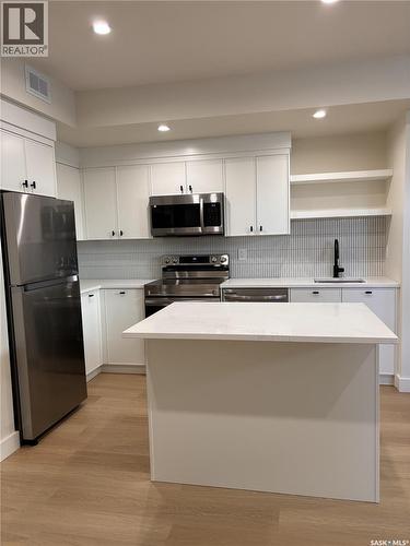 652 Pepper Bend, Saskatoon, SK - Indoor Photo Showing Kitchen With Double Sink