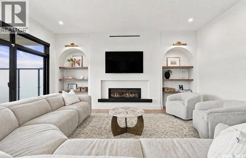 652 Pepper Bend, Saskatoon, SK - Indoor Photo Showing Living Room With Fireplace