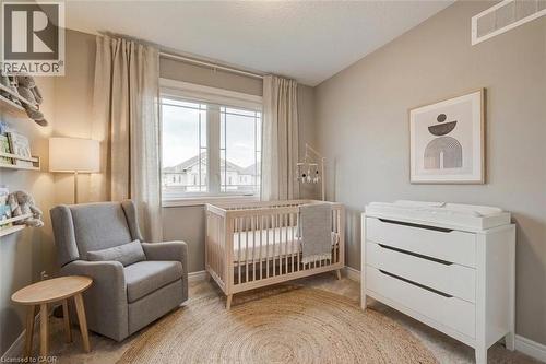 Digitally staged 1st bedroom as a nursery - 77 John Brabson Crescent, Guelph, ON - Indoor Photo Showing Other Room