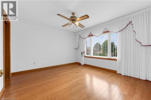 Hardwood-style flooring throughout - 35 Glen Park Court, Hamilton, ON - Indoor Photo Showing Other Room