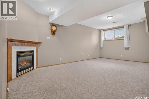 3547 Hazel Grove, Regina, SK - Indoor Photo Showing Other Room With Fireplace