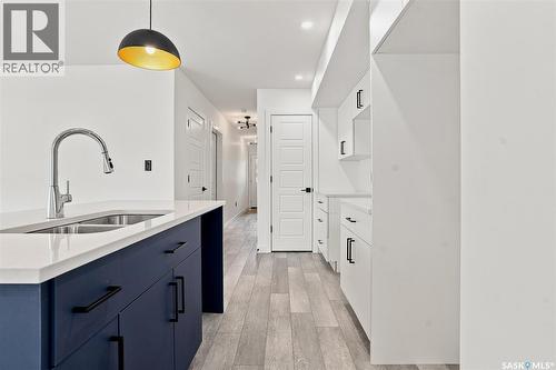 1220 H Avenue N, Saskatoon, SK - Indoor Photo Showing Kitchen With Double Sink