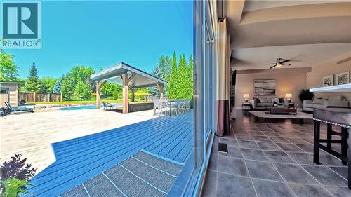 Expansive outdoor patio with a covered gazebo, swimming pool, and wood deck - 913 Valebrook Court, Kitchener, ON - 