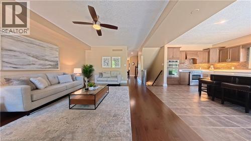 Open-concept living area with wood-finish flooring, a ceiling fan, and recessed lighting - 913 Valebrook Court, Kitchener, ON - Indoor Photo Showing Living Room