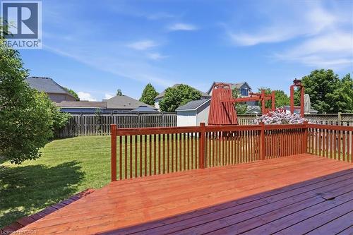 Expansive composite deck with rich wood-finish decking and coordinating railings overlooking manicured grounds - 43 Decaro Crescent, Cambridge, ON - Outdoor