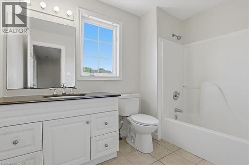 Bright, spa-inspired bathroom featuring a white vanity with dual sink configuration, brushed nickel hardware, and a mirrored medicine cabinet with integrated lighting - 43 Decaro Crescent, Cambridge, ON - Indoor Photo Showing Bathroom