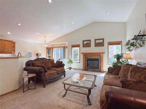 150 Lynx Crescent, Brandon, MB - Indoor Photo Showing Living Room With Fireplace