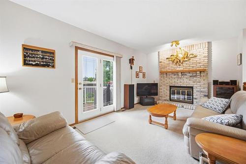 164 Apple Hill Rd, Winnipeg, MB - Indoor Photo Showing Living Room With Fireplace