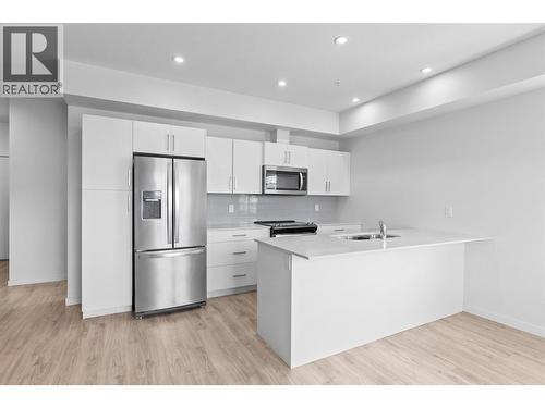Virtually staged to showcase potential use of space - 2345 Butt Road Unit# 415, West Kelowna, BC - Indoor Photo Showing Kitchen