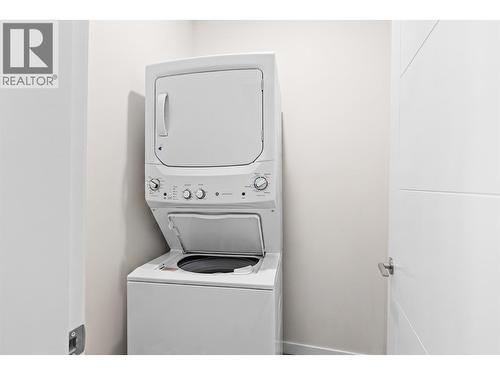 Virtually staged to showcase potential use of space - 2345 Butt Road Unit# 415, West Kelowna, BC - Indoor Photo Showing Laundry Room
