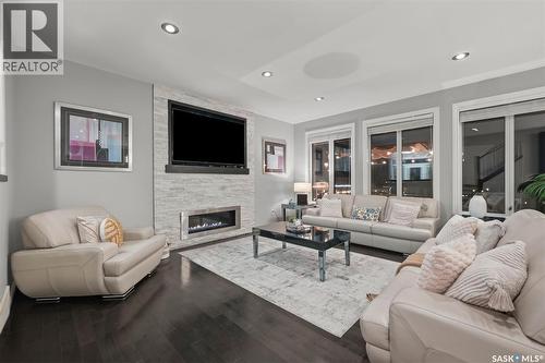 107 Schumacher Bay, Saskatoon, SK - Indoor Photo Showing Living Room With Fireplace