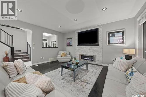 107 Schumacher Bay, Saskatoon, SK - Indoor Photo Showing Living Room With Fireplace