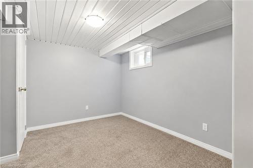 Finished Basement Room with Neutral Paint Finish, Plush Carpeting, and Recessed Lighting This versatile basement space features fresh neutral wall paint, comfortable carpet flooring, and integrated r - 23 Kipling Road, Hamilton, ON - Indoor Photo Showing Other Room
