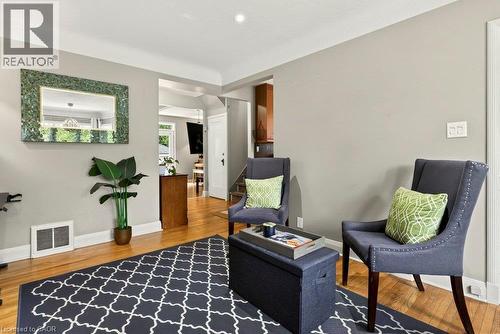 Hardwood flooring, light gray wall paint, and white trim molding throughout - 23 Kipling Road, Hamilton, ON - Indoor