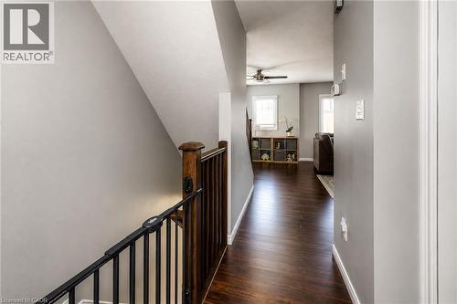Hallway with wood-finish flooring, light gray walls, and white trim - 750 Lawrence Street Unit# 86, Cambridge, ON - Indoor Photo Showing Other Room