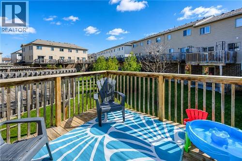 Expansive wood deck with a full wood railing, providing an elevated outdoor living area - 750 Lawrence Street Unit# 86, Cambridge, ON - Outdoor With Deck Patio Veranda With Exterior