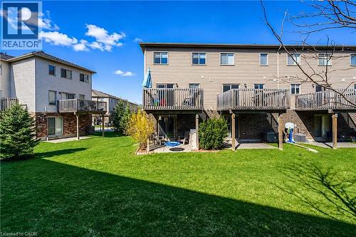 Expansive green space featuring multiple elevated wood decks, lower patios, and mature landscaping - 750 Lawrence Street Unit# 86, Cambridge, ON - Outdoor With Deck Patio Veranda