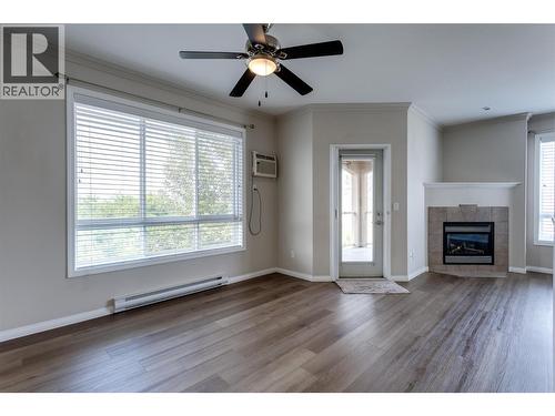 1962 Enterprise Way Unit# 401, Kelowna, BC - Indoor With Fireplace
