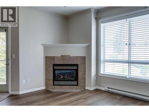 1962 Enterprise Way Unit# 401, Kelowna, BC - Indoor Photo Showing Living Room With Fireplace