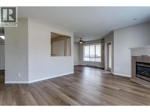 1962 Enterprise Way Unit# 401, Kelowna, BC - Indoor Photo Showing Living Room With Fireplace