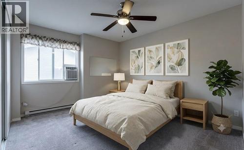 Primary Virtually Staged - 1962 Enterprise Way Unit# 401, Kelowna, BC - Indoor Photo Showing Bedroom