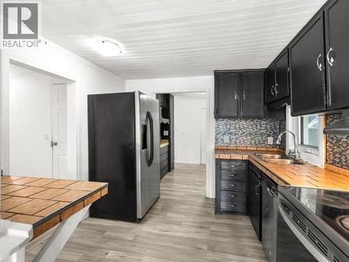 200-26 Azure Road, Whitehorse, YT - Indoor Photo Showing Kitchen With Double Sink