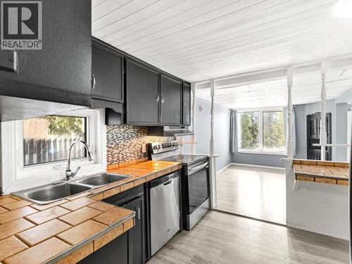 200-26 Azure Road, Whitehorse, YT - Indoor Photo Showing Kitchen With Double Sink