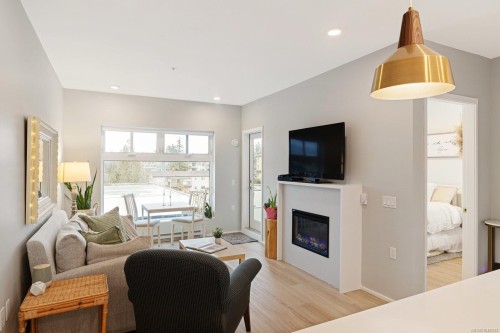 #303-2348 Beacon Ave, Sidney, BC - Indoor Photo Showing Living Room With Fireplace