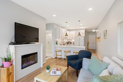 #303-2348 Beacon Ave, Sidney, BC - Indoor Photo Showing Living Room With Fireplace