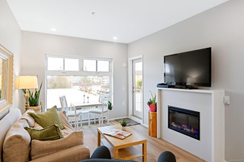 #303-2348 Beacon Ave, Sidney, BC - Indoor Photo Showing Living Room With Fireplace