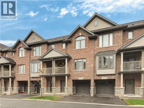Brick exterior with stone accents and multiple balconies - 19 Picardy Drive Unit# 13, Hamilton, ON - Outdoor With Facade