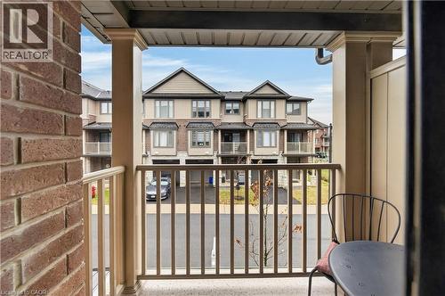 Balcony with a decorative railing, supported by columns - 19 Picardy Drive Unit# 13, Hamilton, ON - Outdoor