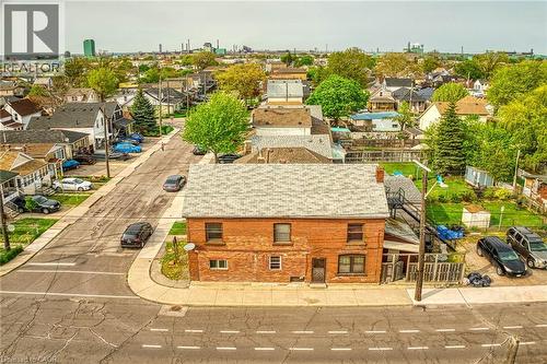 Brick exterior residence with a shingled roof, positioned on a corner lot - 1367 Cannon Street E, Hamilton, ON - Outdoor