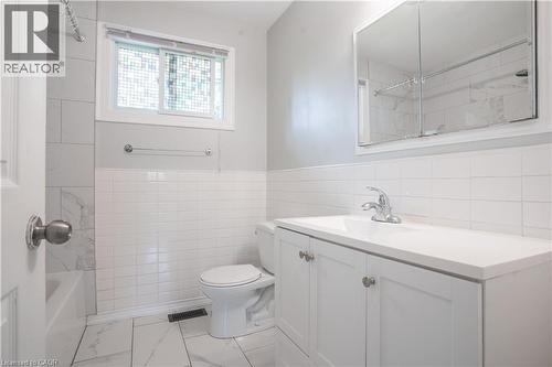 White vanity with integrated sink, chrome faucet, and mirrored medicine cabinet - 695 Glen Forrest Boulevard Unit# Upper, Waterloo, ON - Indoor Photo Showing Bathroom