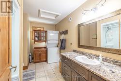 MAIN FLOOR FULL BATH COMBINED WITH LAUNDRY - 
