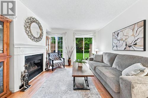 11 - 210 Manitoba Street, Toronto, ON - Indoor Photo Showing Living Room With Fireplace