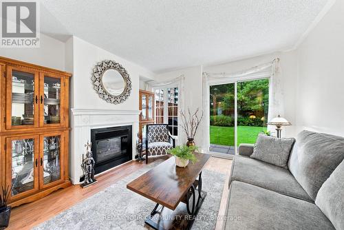 11 - 210 Manitoba Street, Toronto, ON - Indoor Photo Showing Living Room With Fireplace