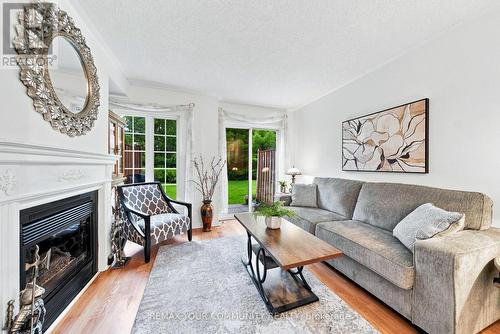 11 - 210 Manitoba Street, Toronto, ON - Indoor Photo Showing Living Room With Fireplace