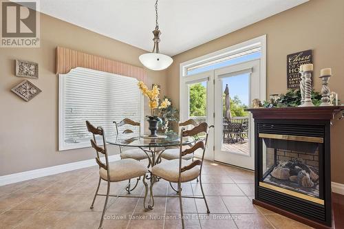 70 Bathgate Drive, Guelph (Kortright East), ON - Indoor Photo Showing Dining Room With Fireplace