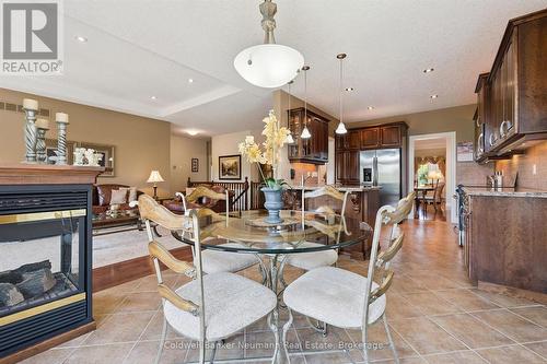 70 Bathgate Drive, Guelph (Kortright East), ON - Indoor Photo Showing Dining Room With Fireplace