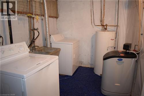 Basement laundry area with a utility sink and exposed piping - 655 Albert Street Unit# A, Waterloo, ON - Indoor Photo Showing Laundry Room