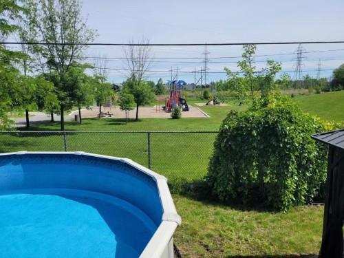 Piscine - 55 Rue Picasso, La Prairie, QC - Outdoor With Above Ground Pool With Backyard
